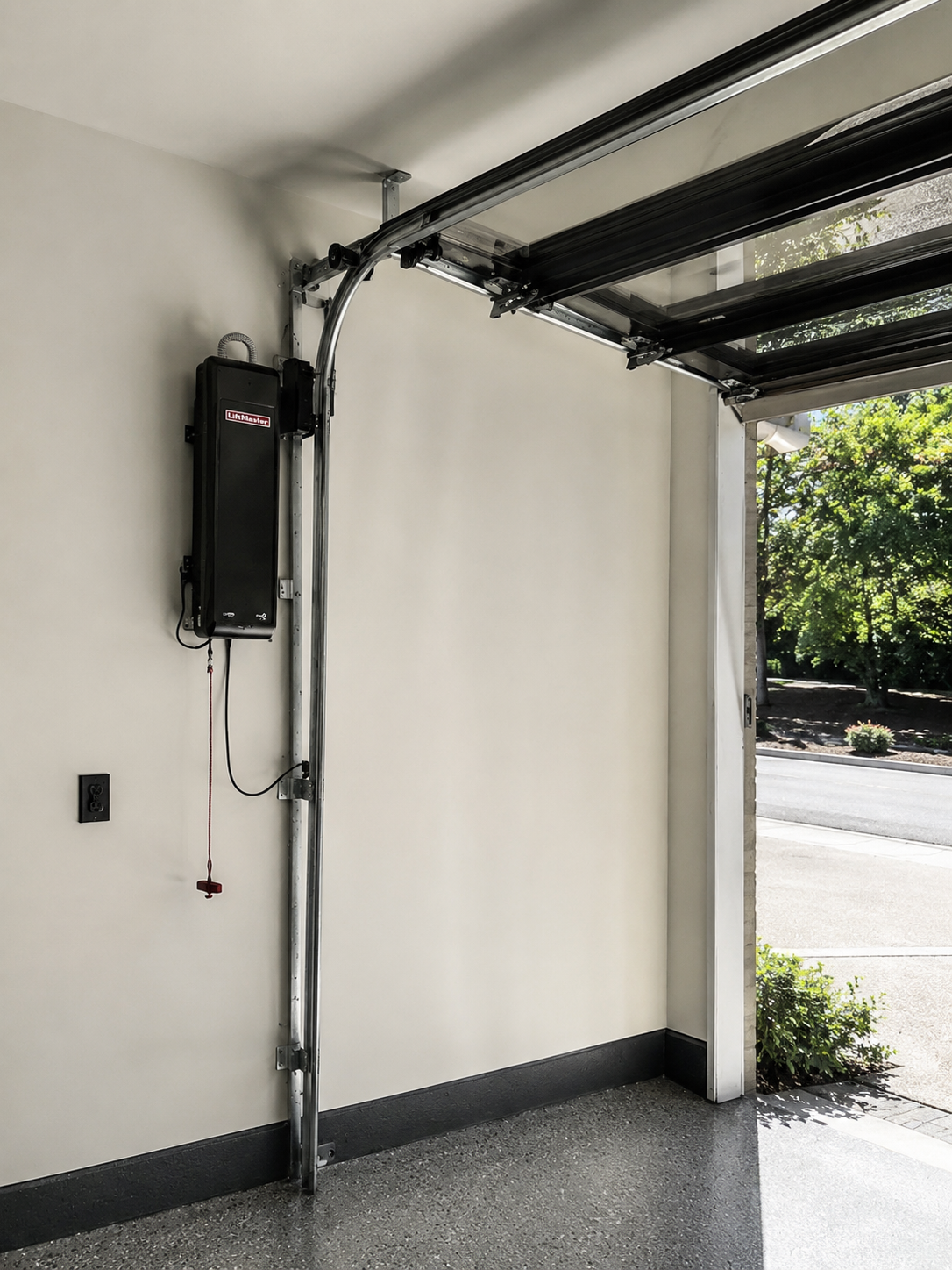 Wall mount jackshaft garage door opener installed in Half Moon Bay garage — space-saving smart system with battery backup